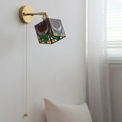 A brass wall sconce with colorful square glass featuring red purple green and yellow floral design for bedroom decorbites wall lights