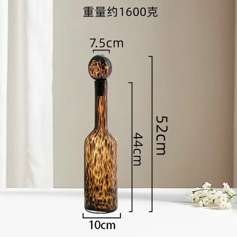 A tall 52cm glass decanter with a leopard print pattern and spherical stopper for living room decorbites leopard print decor