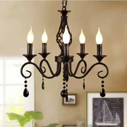 Traditional black wrought iron pendant chandelier with five candle-style bulbs and decorbites crystal pendant accents