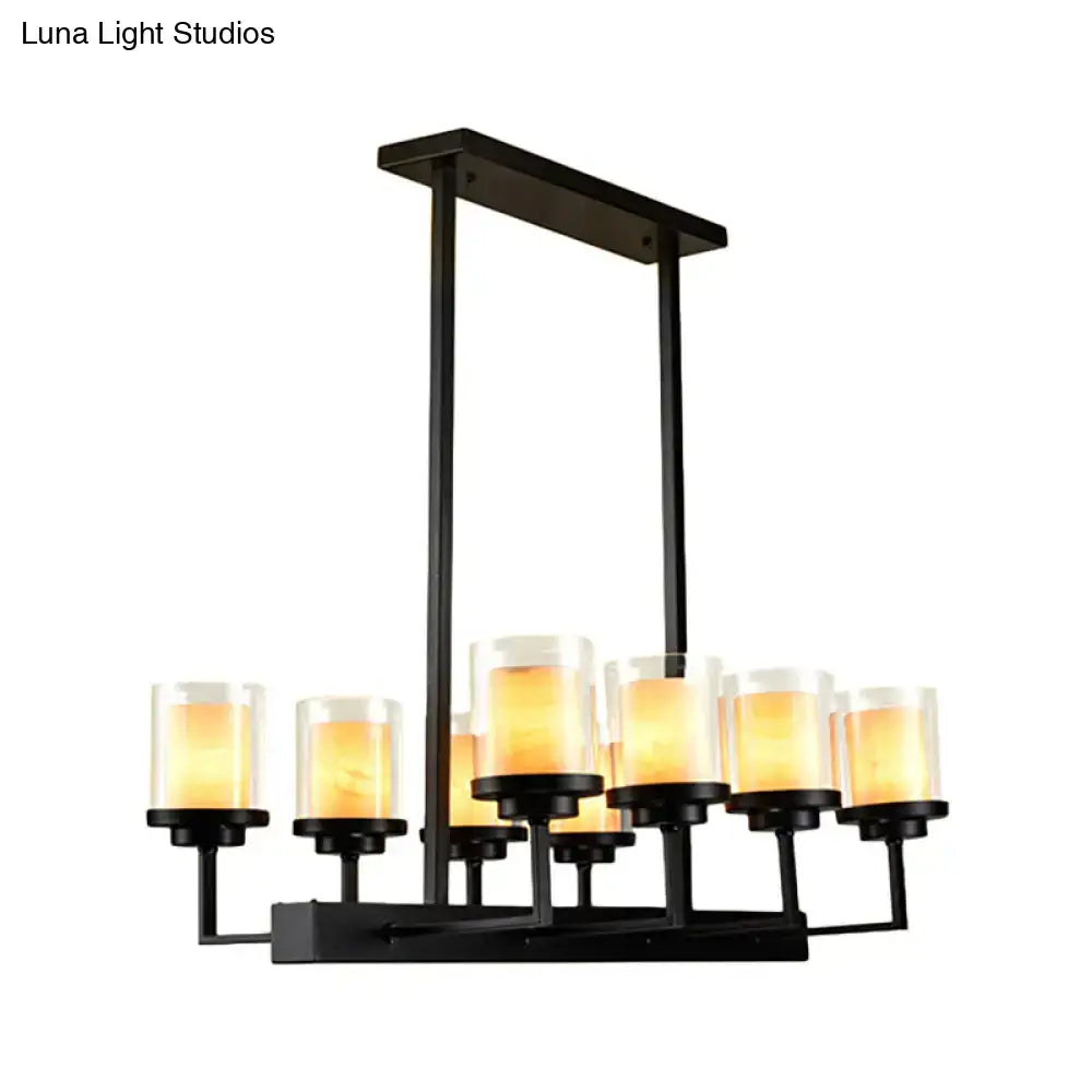 Traditional black cylinder island pendant light with eight warm-toned clear glass candle-style shades for dining room lighting