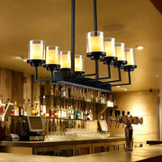 DecorBites traditional black cylinder island pendant light with clear glass shades and warm glow for dining room lighting