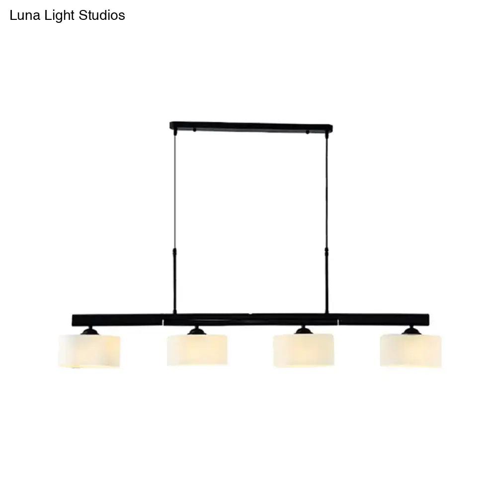 Black metal traditional drum island pendant light with four frosted white glass shades for dining room