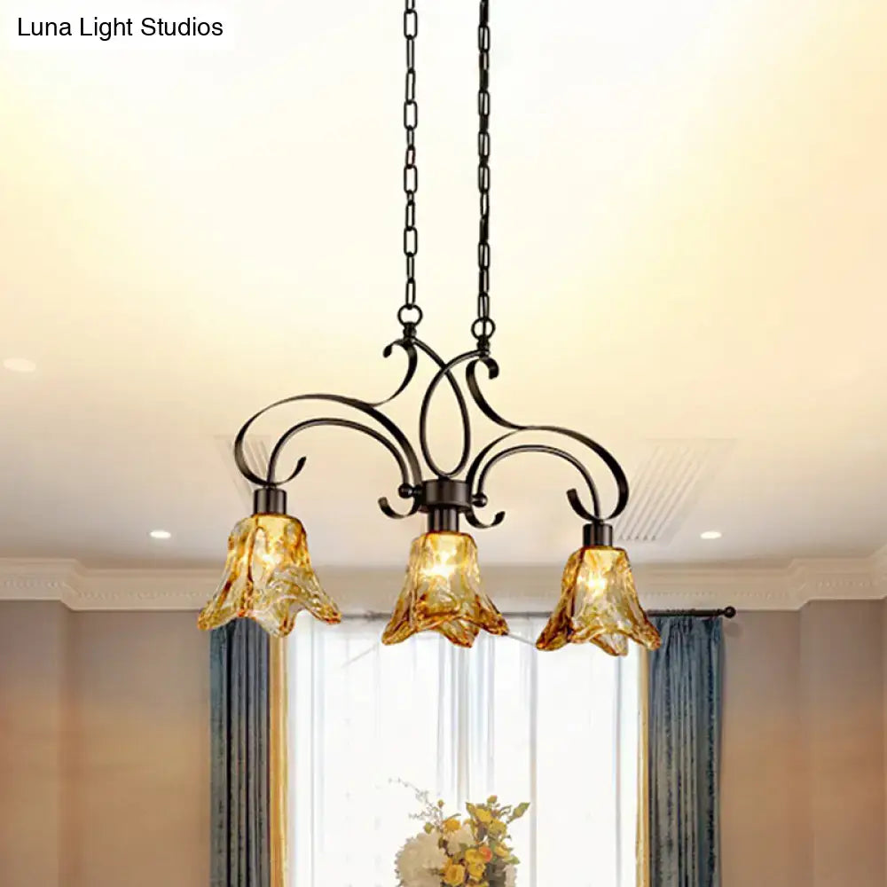Antique bronze wrought iron chandelier with three amber glass bell shades for dining room black island lamp lighting
