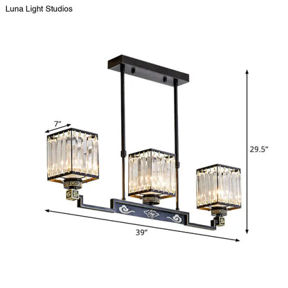 Black metal crystal island chandelier with three rectangular shades and ornate cloud motifs for traditional dining rooms