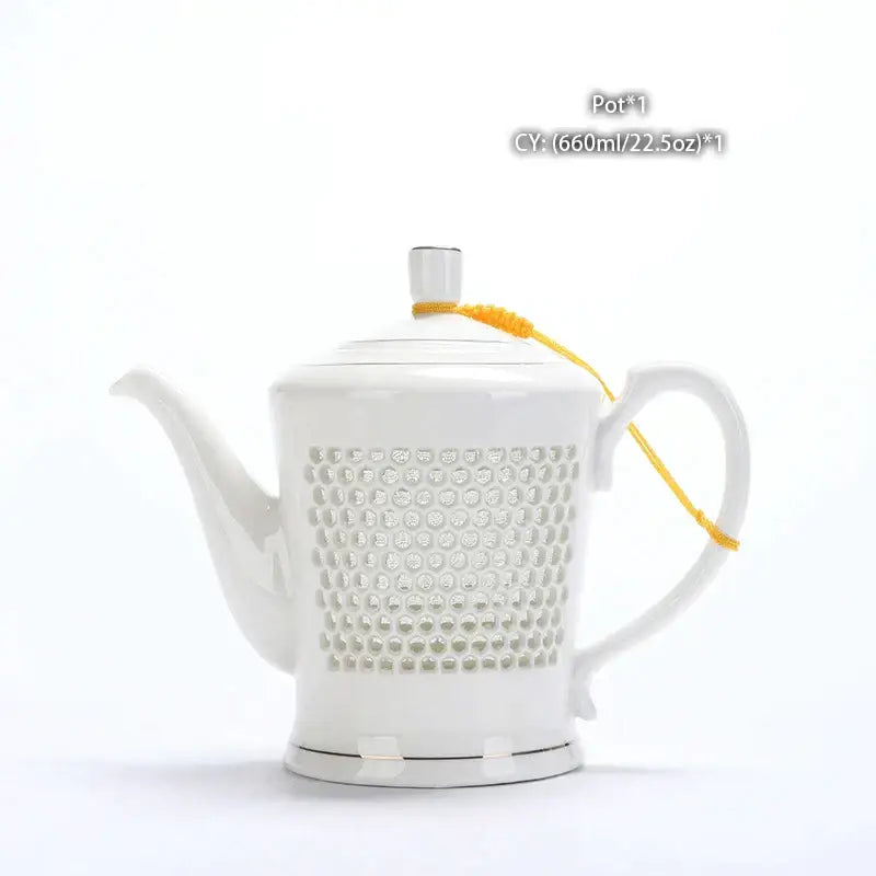 Traditional blue white porcelain tea pot with white ceramic honeycomb body silver knob and yellow cord handle decorbites blue white