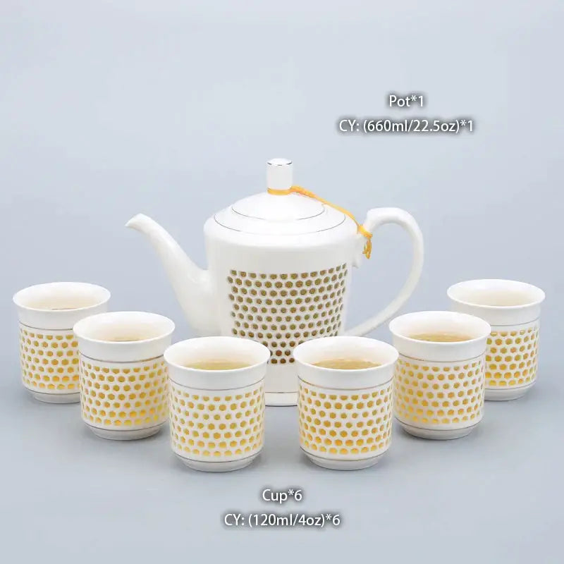 Traditional blue and white porcelain tea pot with gold dot pattern silver rim and six matching ceramic cups decorbites blue white