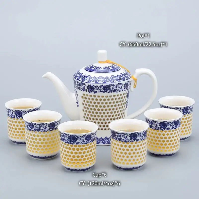 Traditional blue white porcelain tea pot and cups with perforated honeycomb pattern by decorbites for kitchen use