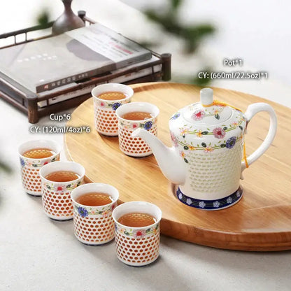Traditional blue and white porcelain tea teapot with honeycomb texture floral patterns and blue decorative band decorbites blue white