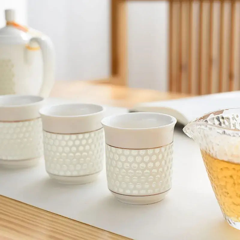White porcelain tea cups with honeycomb texture and gold trim from decorbites blue white porcelain tea set