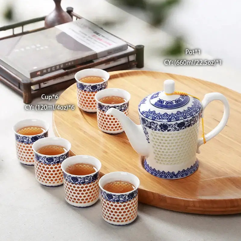 White porcelain tea set teapot with blue white porcelain floral geometric patterns and textured honeycomb decorbites blue white