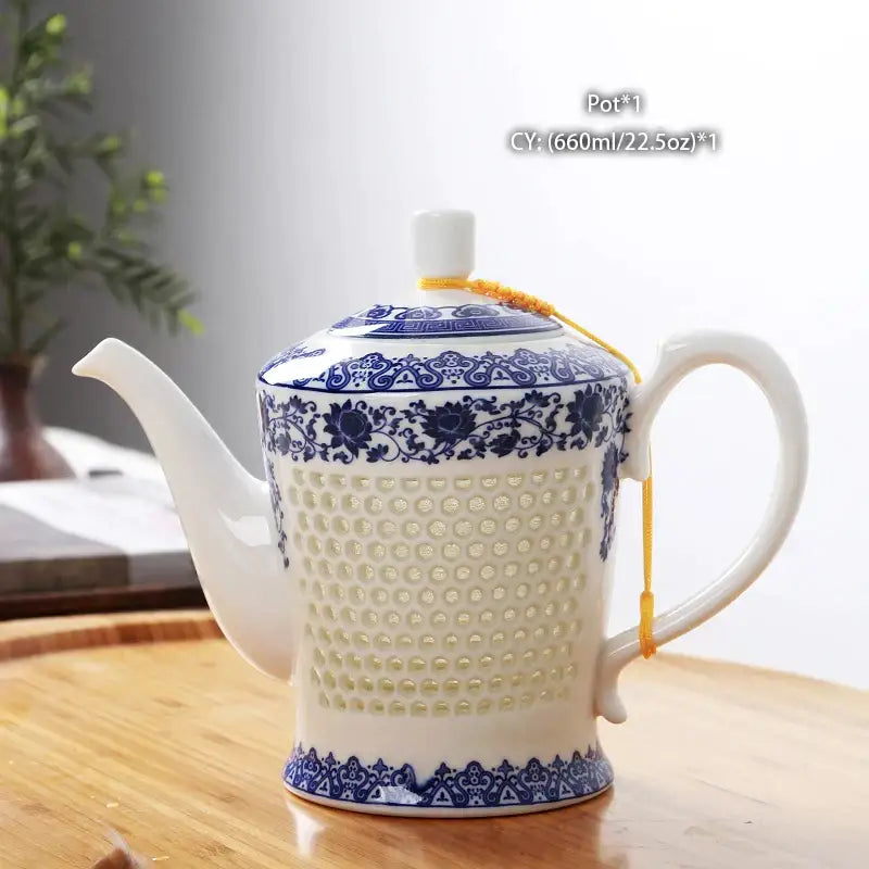 White porcelain tea with intricate blue floral patterns and perforated body from decorbites blue white collection