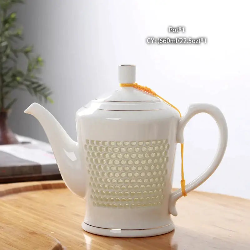 White porcelain tea teapot with perforated pattern and orange cord from decorbites blue white porcelain set
