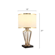 Gold-toned decorbites traditional single brass table light with cream drum shade on black pedestal e26 e27 110v-120v