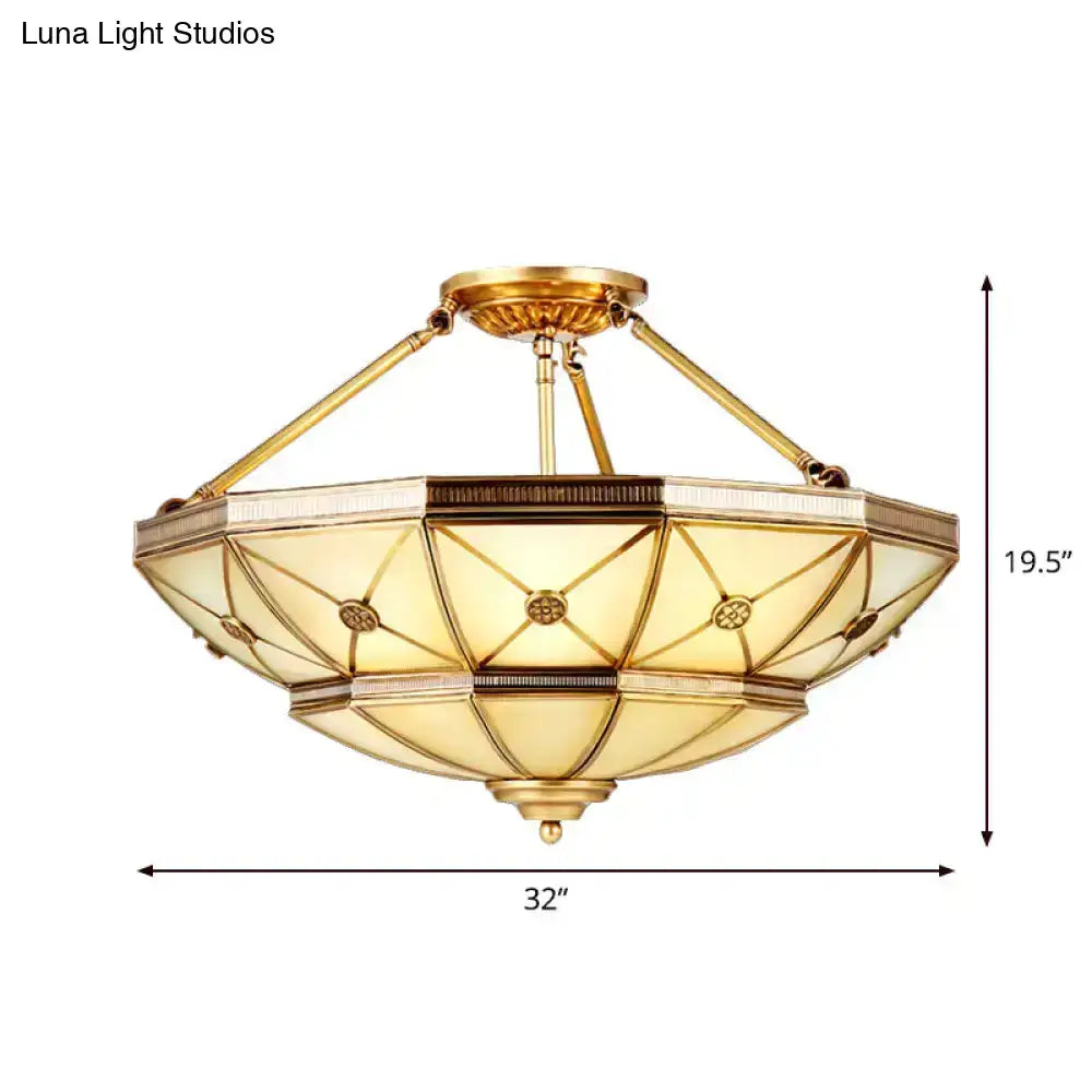 Gold-toned semi-flush mount fixture with 23.5 to 32 inch width and amber frosted glass for 220v-240v use