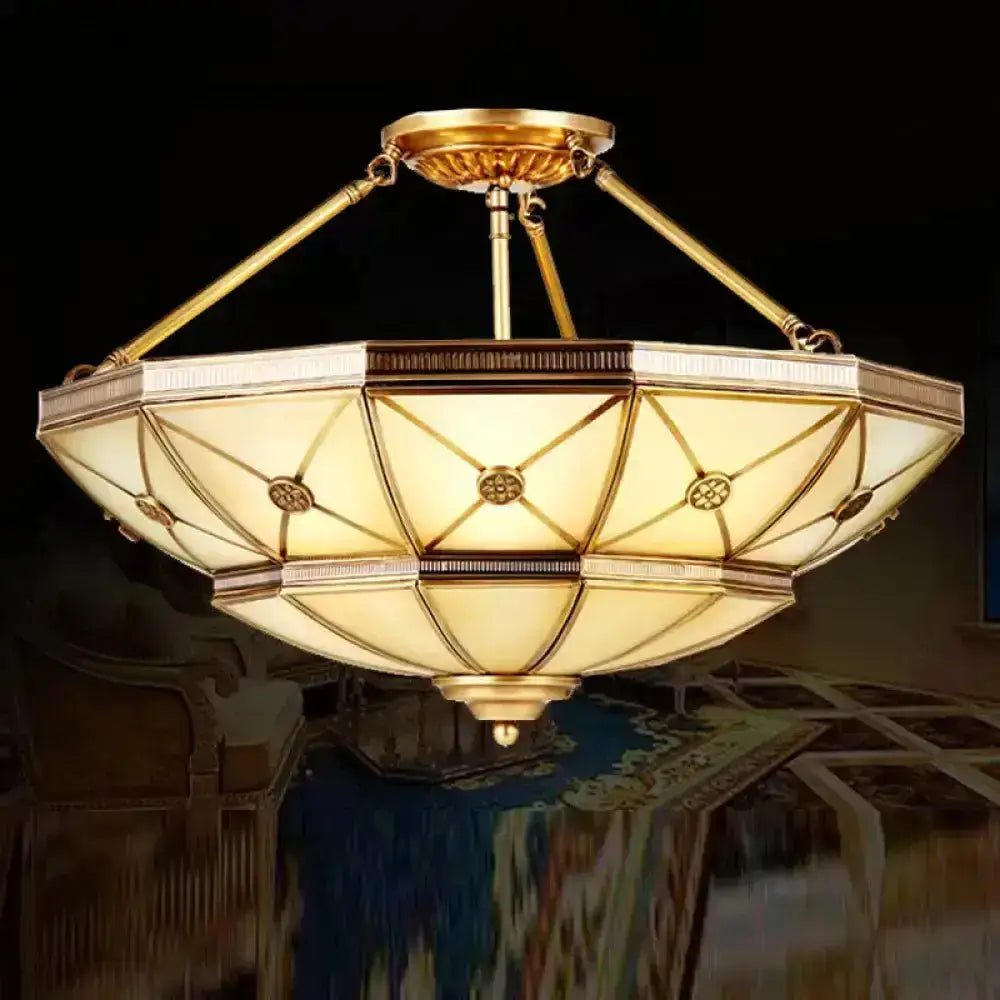 Gold-toned semi-flush mount fixture with 23.5’’/32’’ width and geometric octagonal glass shade for 220v-240v use