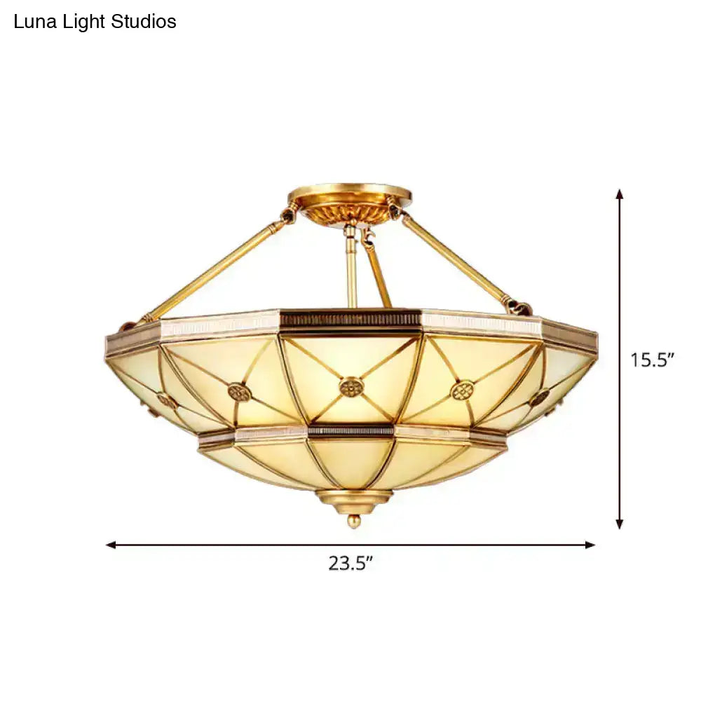 Gold-toned brass semi-flush mount fixture 23.5 inch width with amber glass panels for 220v-240v use