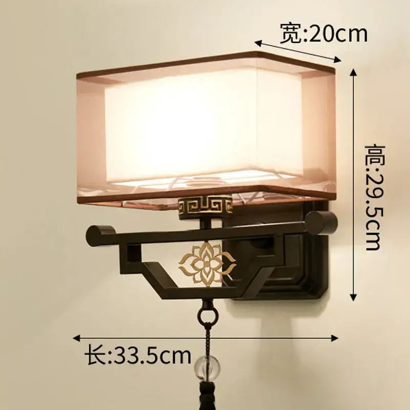 Traditional bronze floral elegant fabric wall lamp with antique bronze frame and gold cutouts for bedroom lighting decorbites elegant fabric wall lamp