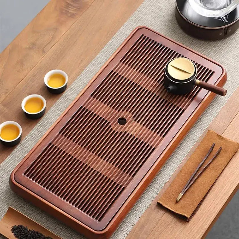 Rectangular traditional brown bamboo tea tray with water storage and drainage grooves for dining room use