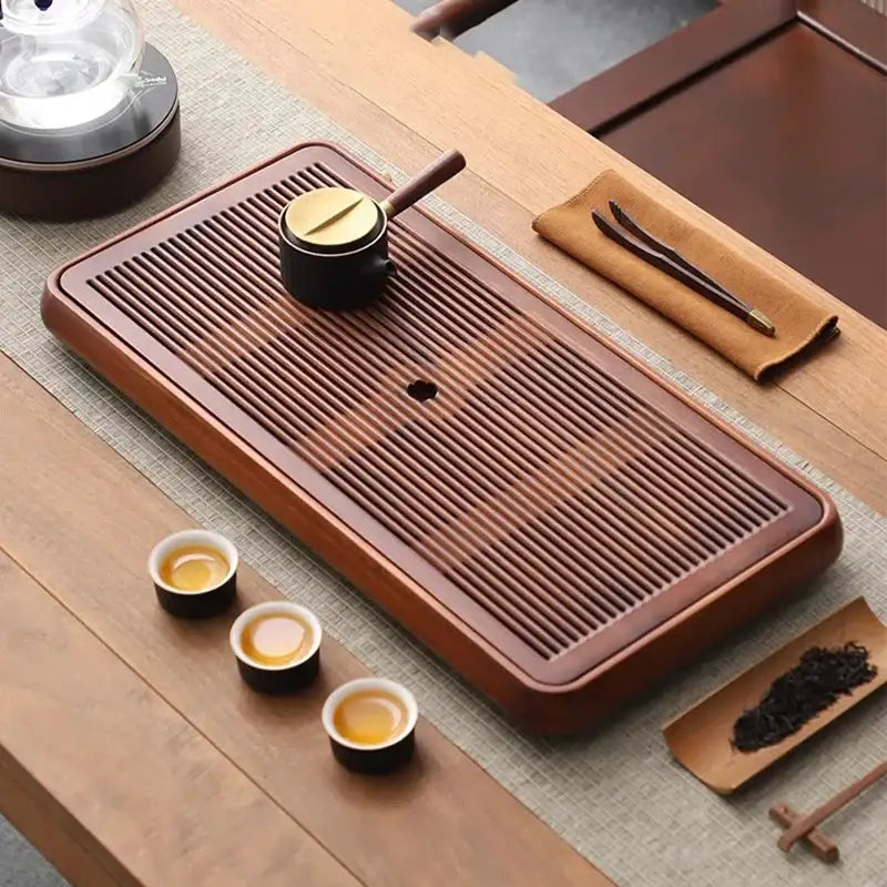 Traditional brown bamboo tea tray with rich finish and parallel grooves for water storage and dining room use