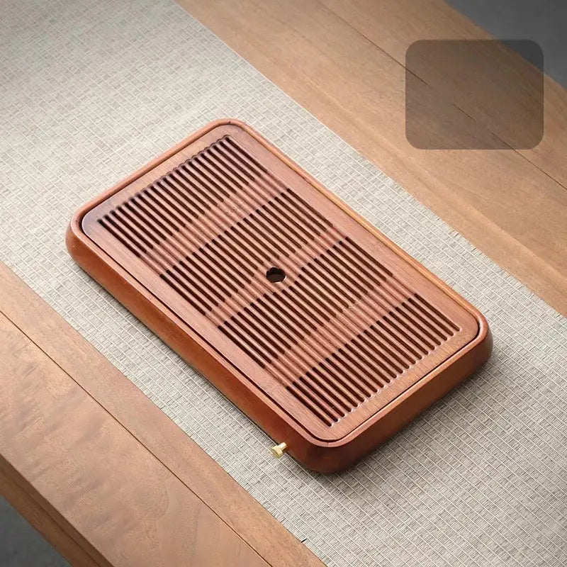 Traditional brown bamboo tea tray with water storage features a rectangular wooden design with drainage grooves and central hole