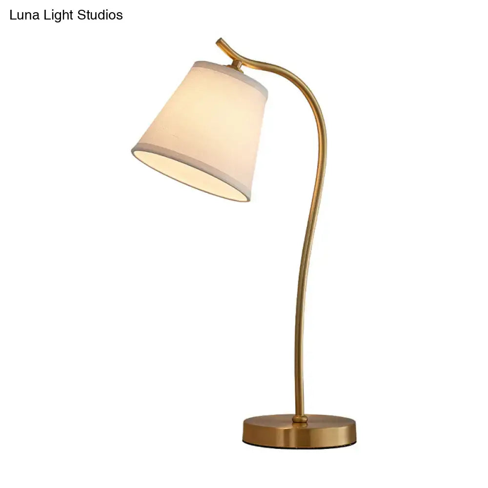 DecorBites™ brass single fabric bedside lamp with a sleek brass finish and traditional bucket table design for 220v-240v use