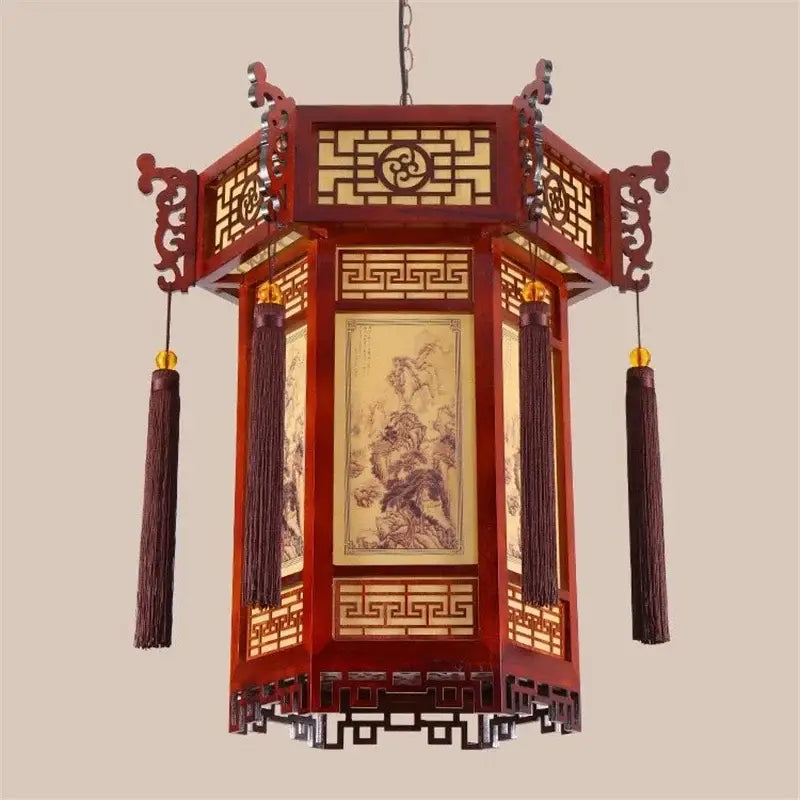 Traditional chinese red wooden bamboo lantern pendant light with intricate lattice work and hanging tassels for dining room decor