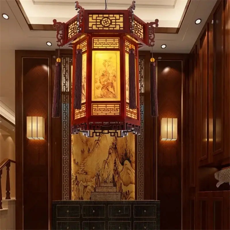 Red wooden traditional chinese carved bamboo lantern pendant light with golden lattice panels and dark purple tassels for dining room