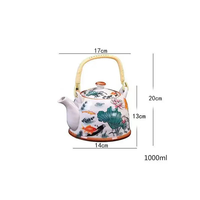 Traditional Chinese white porcelain tea pot with bamboo handle and colorful lotus flowers for dining room decor