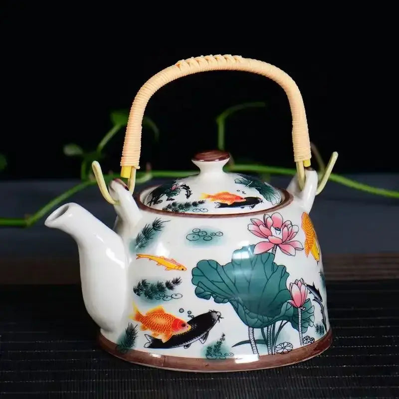 Traditional chinese white porcelain tea pot with colorful koi fish and lotus flowers for dining room decor