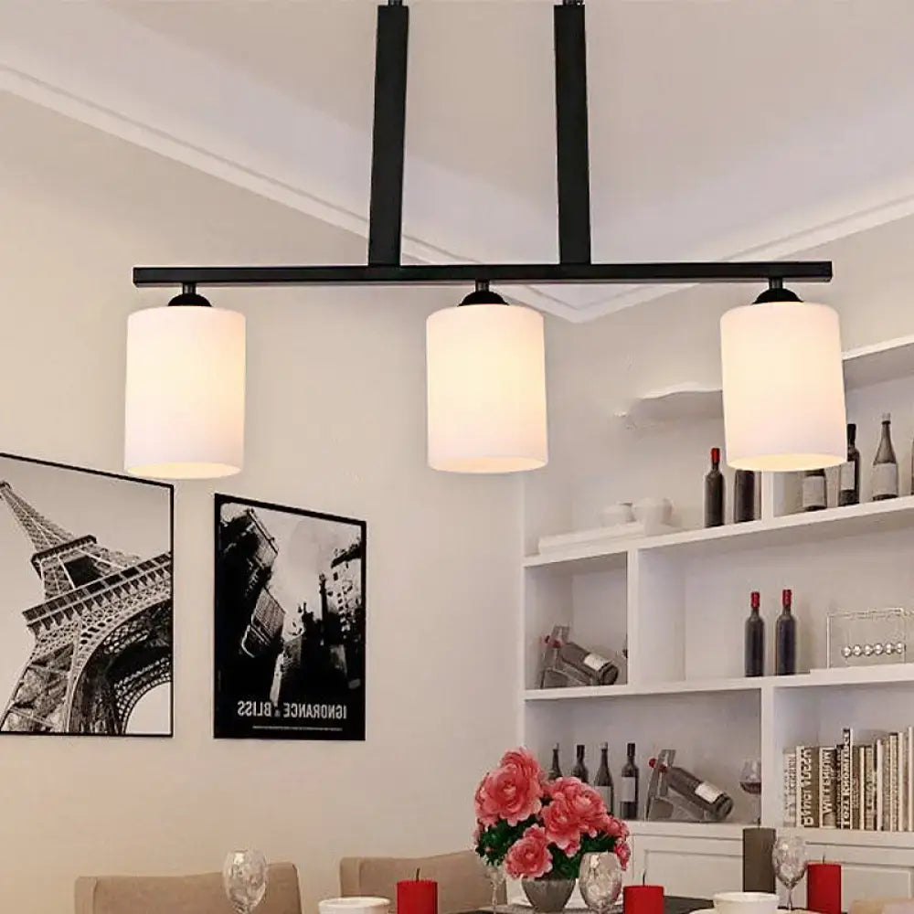 Decorbites frosted glass black island pendant light kit with three cylindrical white frosted glass shades for dining room