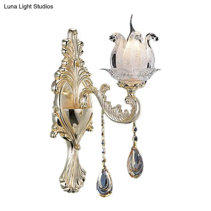 Traditional gold frosted glass sconce with ornate swan crystal motif and teardrop crystals for living room wall light