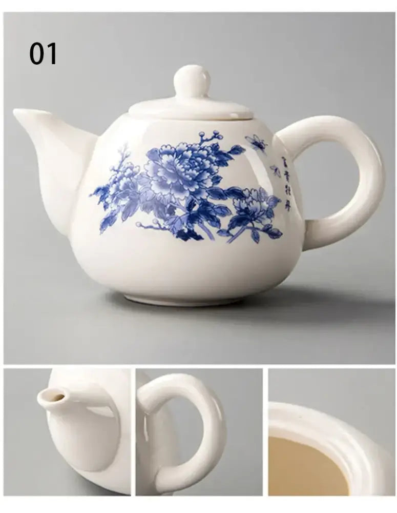 White ceramic teapot with intricate blue floral and calligraphic designs from decorbites dehua clay tea set