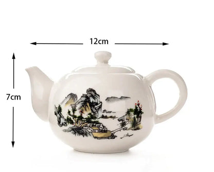White ceramic dehua clay teapot with traditional ink landscape design in black gray and earthy tones for tea set decorbites
