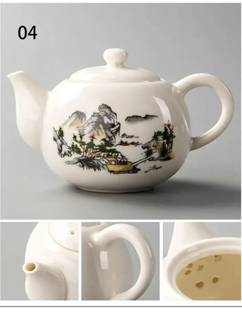 White ceramic dehua clay teapot with traditional ink illustration of mountains trees and buildings in muted colors for tea set decorbites dehua clay