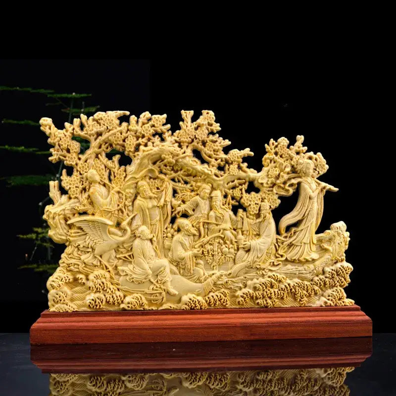 Traditional ivory eight immortals sculpture featuring detailed carved figures under blossoming trees on wooden base for decor