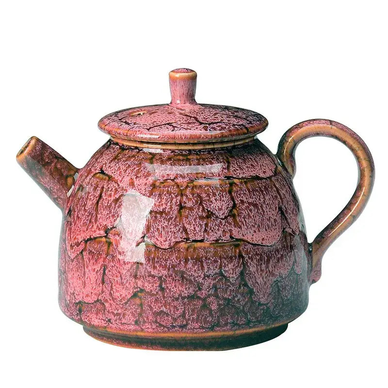 A ceramic kung fu tea pot with crackled pink and brown glaze featuring a rounded body and curved handle by decorbites