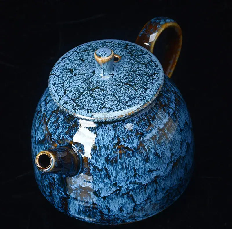 Traditional pink and brown crackle ceramic kung fu tea pot with vibrant blue glaze and gold accents for kung fu tea decorbites