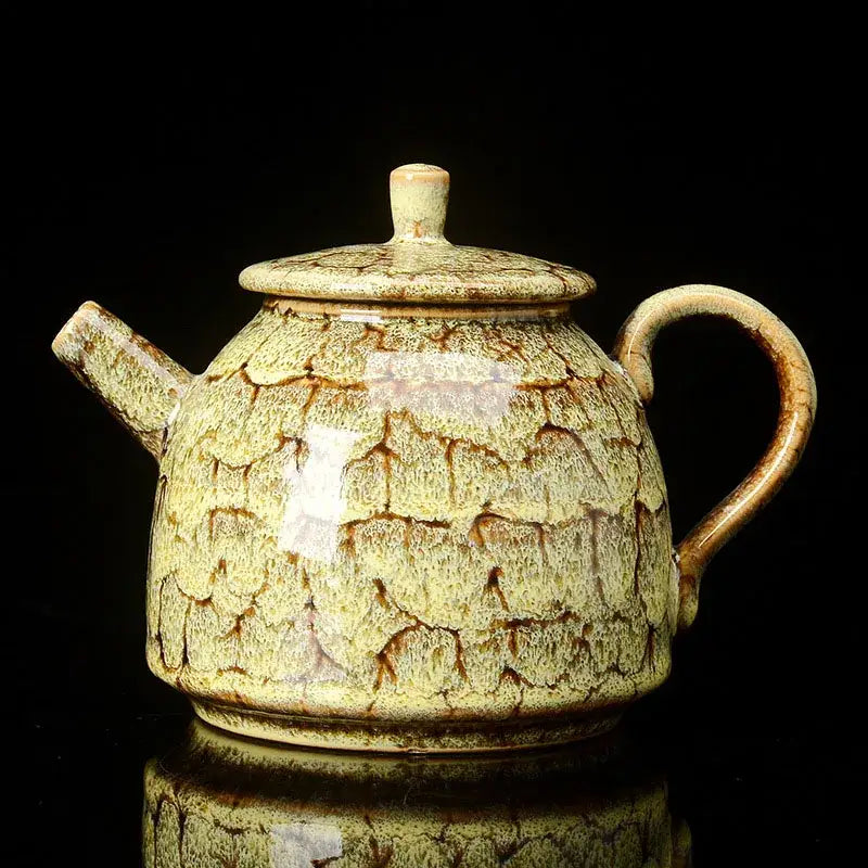 Traditional pink and brown crackle ceramic kung fu tea pot with rounded body and curved handle for tea brewing decorbites ceramic kung