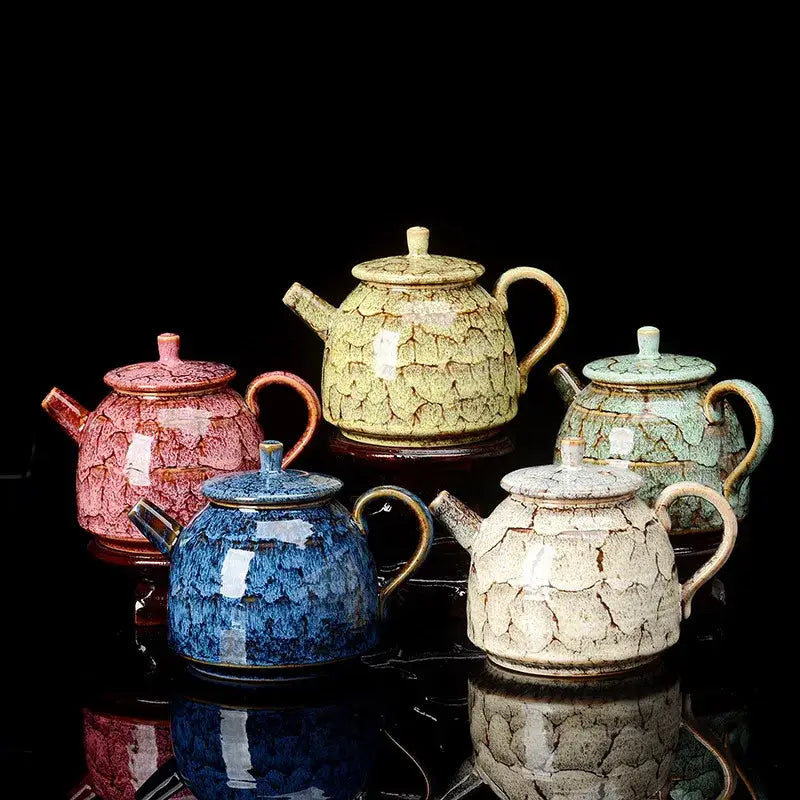 Five ceramic tea pots with crackled glazes in pink, yellow-green, blue, and beige for kung fu tea decorbites ceramic kung use