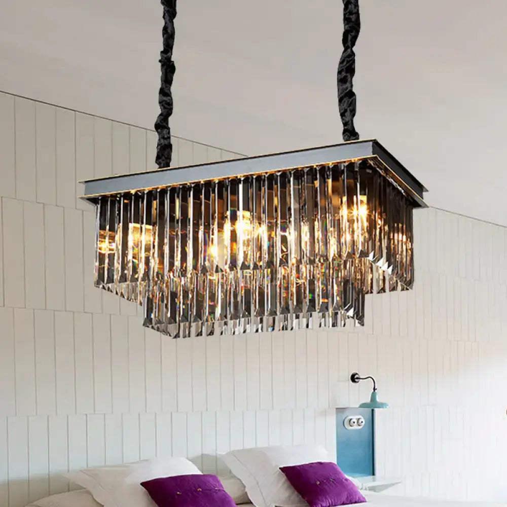 Rectangular light fixture with chrome frame and smoke gray crystal prisms for elegant dining room use