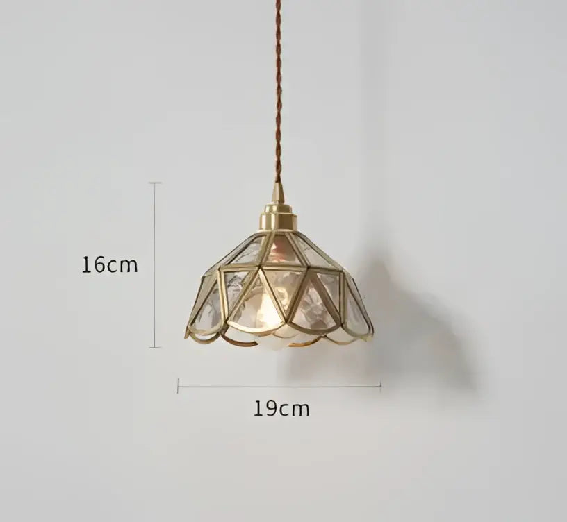 Translucent blue glass pendant light with brass frame features a geometric faceted shade for warm dining room decorbites blue glass pendant lights