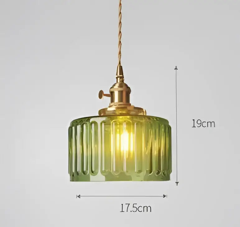 Green ribbed glass pendant light with brass hardware complementing decorbites blue glass pendant for dining room decor