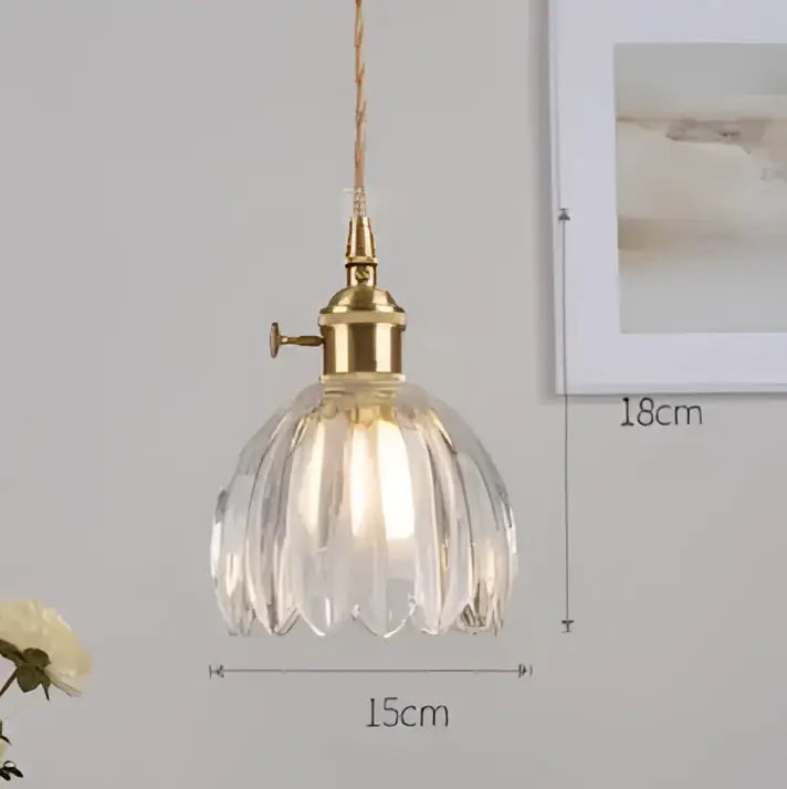 Vintage-style blue glass pendant light with brass fixture featuring faceted petal shade for dining room decorbites blue glass