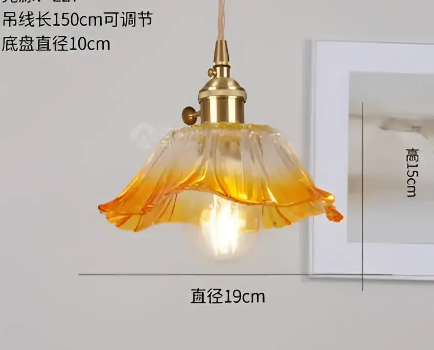 A warm-toned amber glass pendant light with brass fixture and petal design for decorbites blue glass pendant lights collection