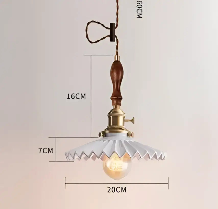 Vintage-style pendant lights with brass fixture wooden handle white ceramic shade complement decorbites blue glass pendant