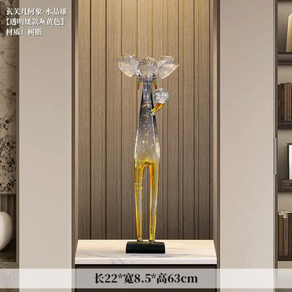 Transparent amber-yellow resin deer sculpture with crystal ears and black base for elephant floor decoration