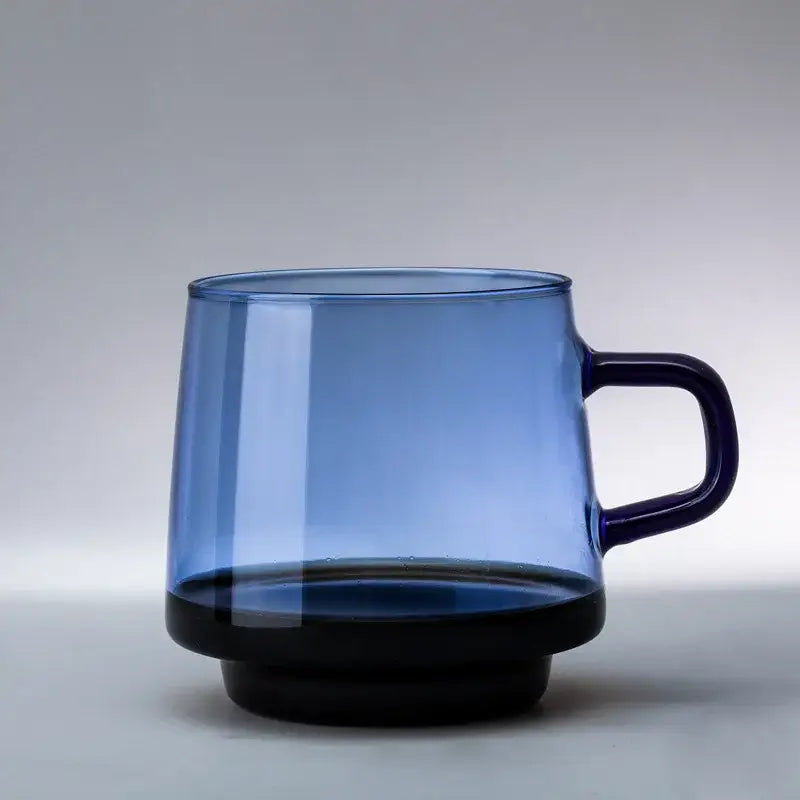 Translucent blue glass coffee mug with solid black base and handle heat resistant for kitchen use