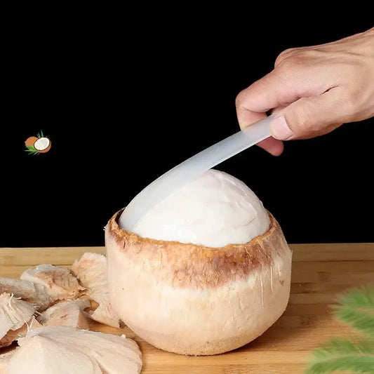 Translucent professional plastic coconut opener tool extracting white flesh from whole brown-shelled coconut decorbites coconut opener