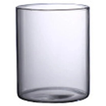 Clear glass hydroponic vase with a smooth cylindrical shape and slightly rounded edges for minimalist decor