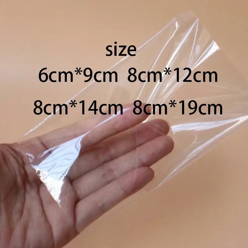 Transparent pink ice cream bags with gold ribbon available in clear plastic sizes 6cm by 9cm to 8cm by 19cm
